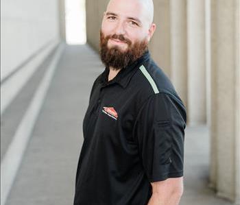 Male SERVPRO employee, brown hair and beard