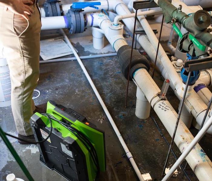 SERVPRO-cleaning-pipes-water