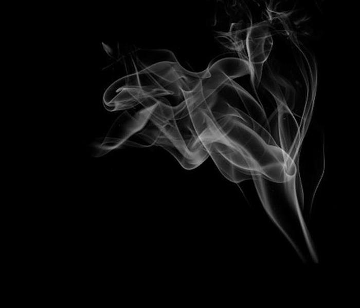 smoke rising against black background